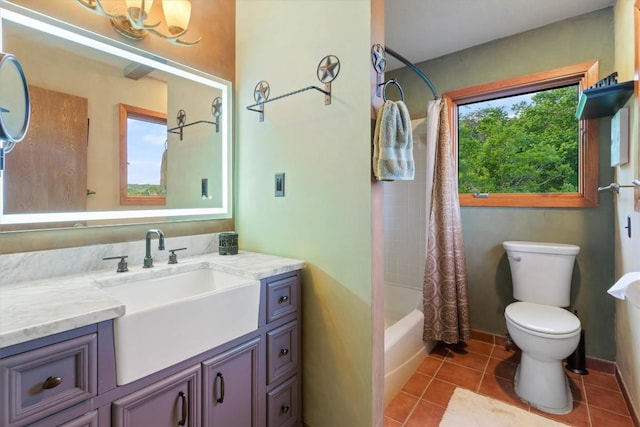 full bathroom with shower / bathtub combination with curtain, vanity, toilet, and tile patterned floors