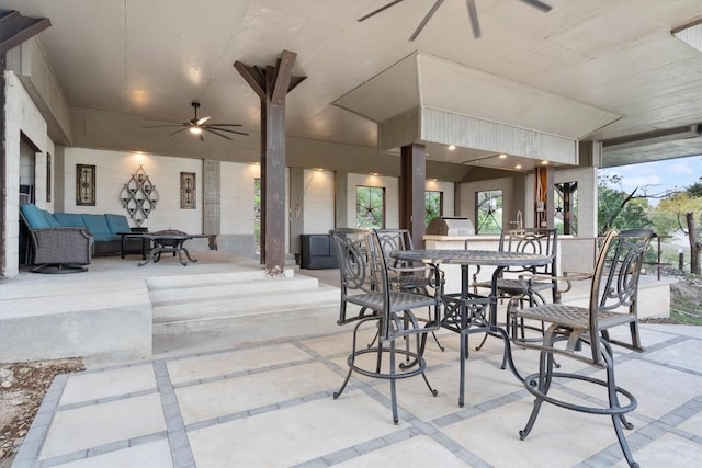 view of patio / terrace with ceiling fan and an outdoor living space