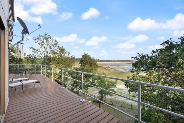 wooden deck featuring a water view