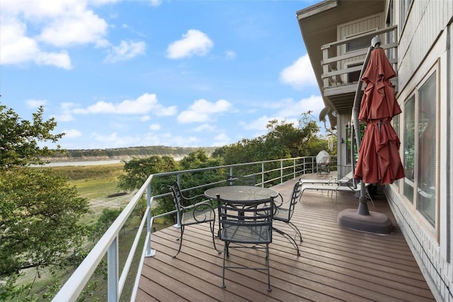 wooden terrace with a water view