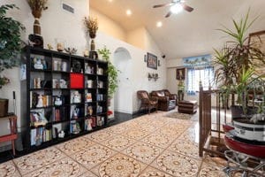 interior space with ceiling fan and lofted ceiling