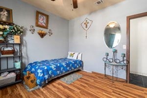 bedroom with hardwood / wood-style flooring and ceiling fan