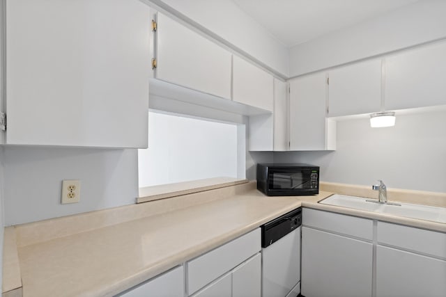 kitchen with dishwasher, white cabinets, and sink