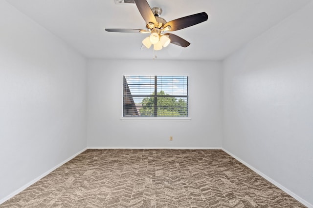 spare room featuring carpet floors and ceiling fan