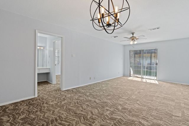 carpeted empty room featuring ceiling fan with notable chandelier