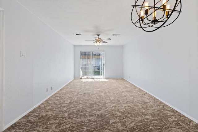 carpeted empty room with ceiling fan with notable chandelier