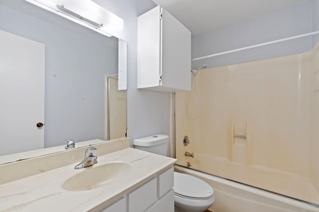 full bathroom with bath / shower combo with glass door, vanity, and toilet