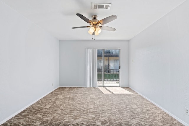 carpeted spare room with ceiling fan