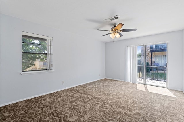 carpeted empty room with ceiling fan