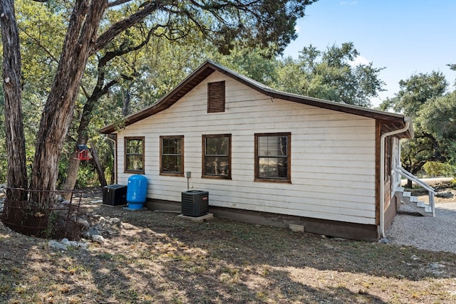 back of house with cooling unit