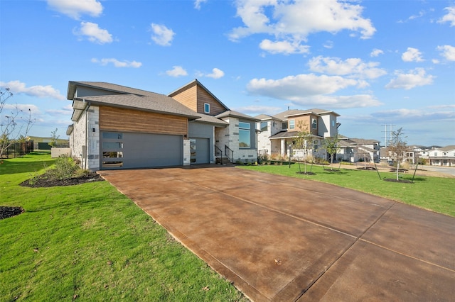 view of front of property featuring a garage and a front lawn