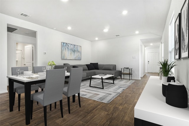 dining space with wood-type flooring