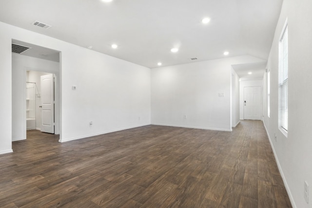 spare room with dark wood-type flooring