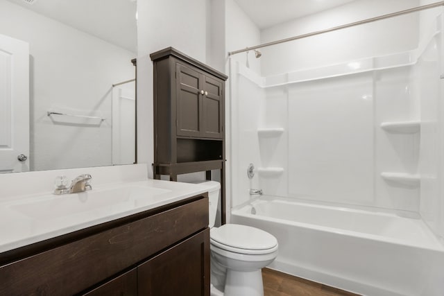 full bathroom featuring shower / tub combination, vanity, toilet, and hardwood / wood-style flooring