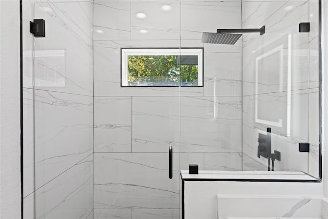 909 Vargas Rd Unit B, Austin, TX 78741 - bathroom with a marble finish shower