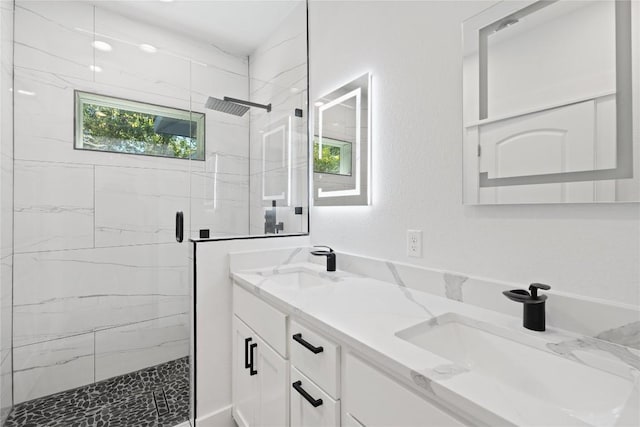 909 Vargas Rd Unit B, Austin, TX 78741 - full bath with double vanity, a marble finish shower, and a sink