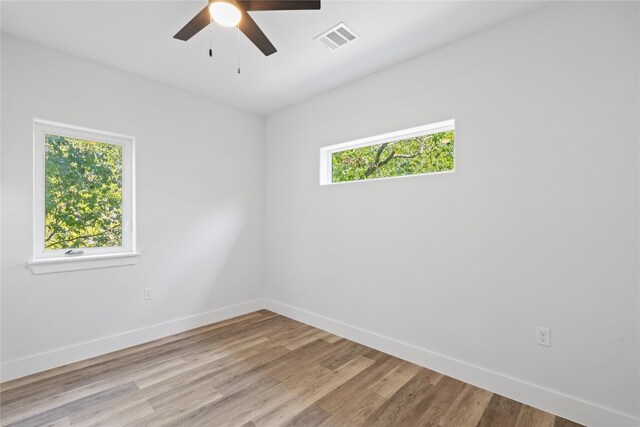 spare room featuring ceiling fan and light hardwood / wood-style flooring