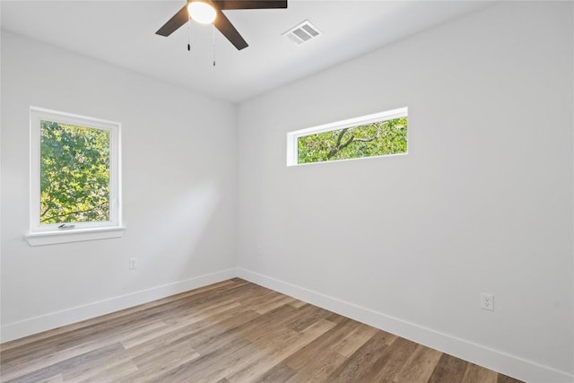 909 Vargas Rd Unit B, Austin, TX 78741 - unfurnished room with baseboards, a ceiling fan, wood finished floors, and visible vents