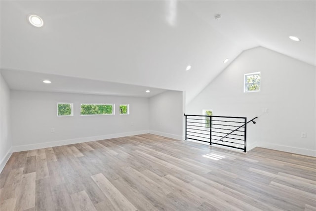 909 Vargas Rd Unit B, Austin, TX 78741 - additional living space with light wood finished floors, vaulted ceiling, a wealth of natural light, and recessed lighting