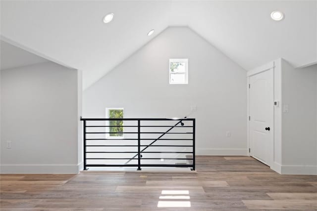 909 Vargas Rd Unit B, Austin, TX 78741 - additional living space with recessed lighting, vaulted ceiling, baseboards, and wood finished floors