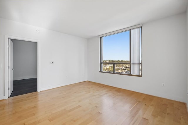 unfurnished room with light wood-style floors