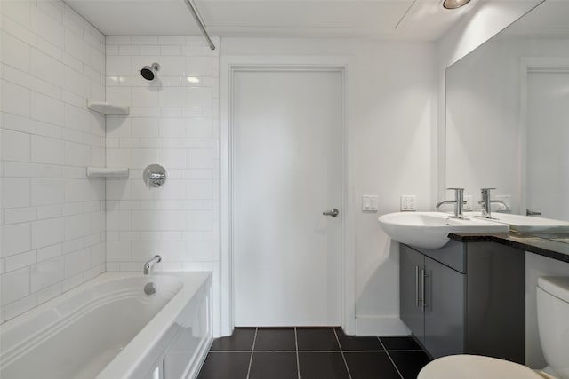 full bathroom with vanity, tiled shower / bath combo, toilet, and tile patterned flooring