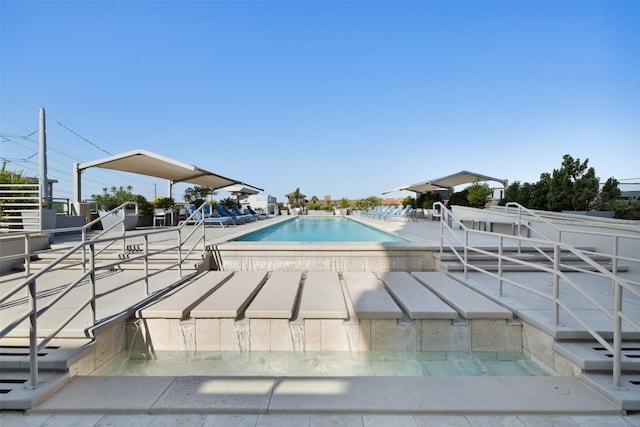 view of swimming pool featuring a patio area