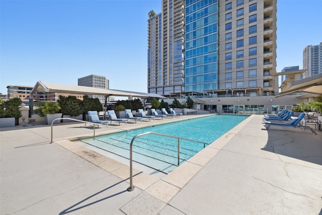 view of swimming pool with a patio area