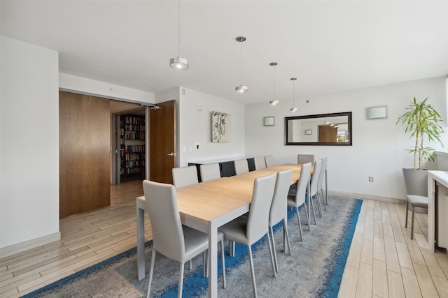 dining area with light hardwood / wood-style flooring