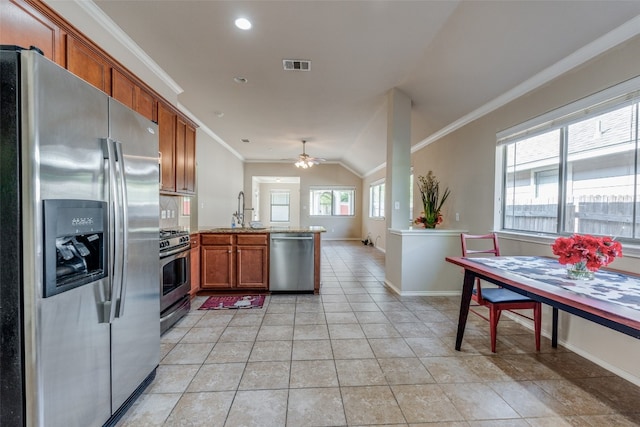 kitchen with appliances with stainless steel finishes, lofted ceiling, crown molding, and ceiling fan