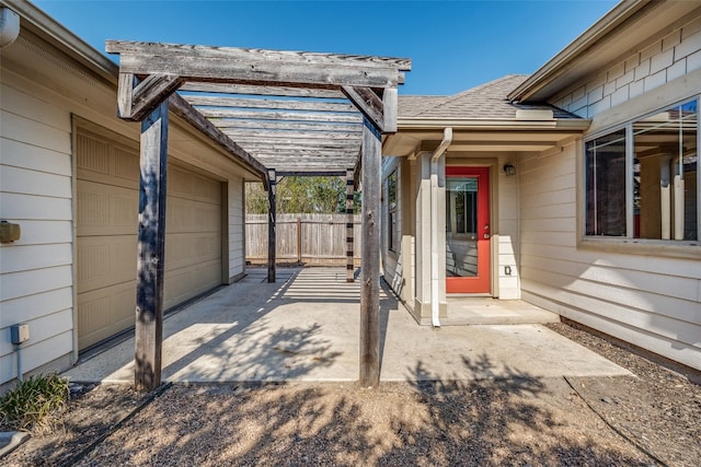 view of patio / terrace featuring a garage