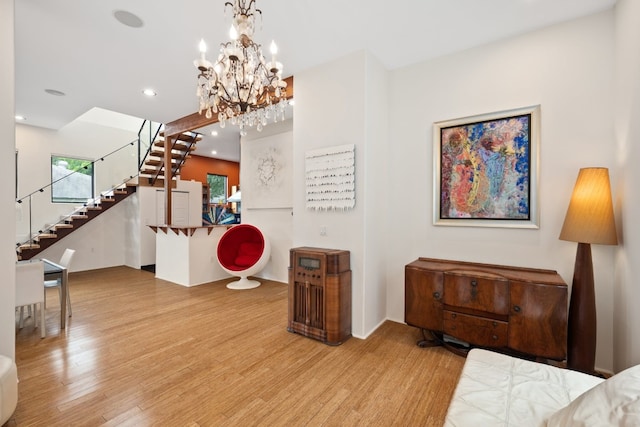 entryway with a chandelier and light hardwood / wood-style flooring