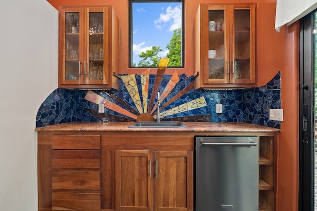 bar featuring decorative backsplash, sink, and dishwasher