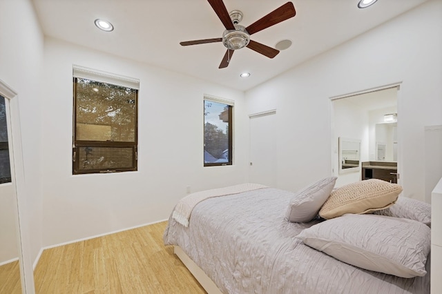 bedroom featuring ceiling fan and light hardwood / wood-style flooring