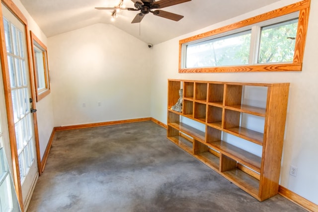 carpeted spare room with ceiling fan and lofted ceiling