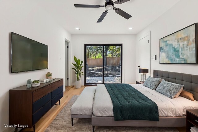 bedroom with light hardwood / wood-style floors and ceiling fan