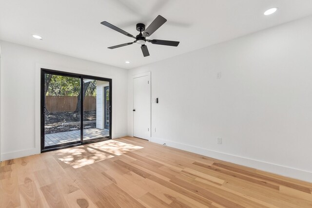 spare room with light hardwood / wood-style flooring and ceiling fan