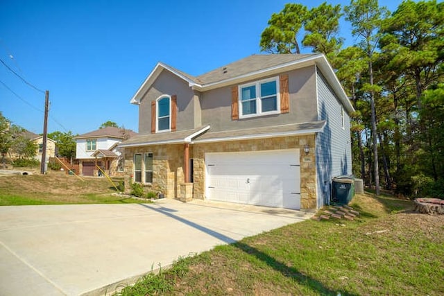 view of front of house with a front lawn and a garage