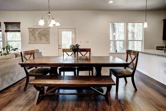 dining space with a chandelier, dark hardwood / wood-style flooring, and a wealth of natural light