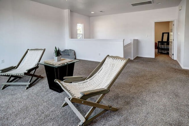 sitting room with carpet floors