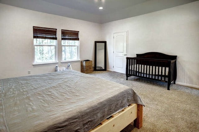 bedroom with light colored carpet