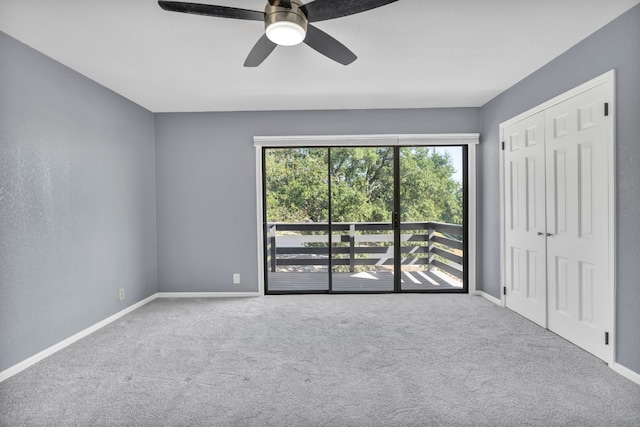 spare room with ceiling fan and carpet floors