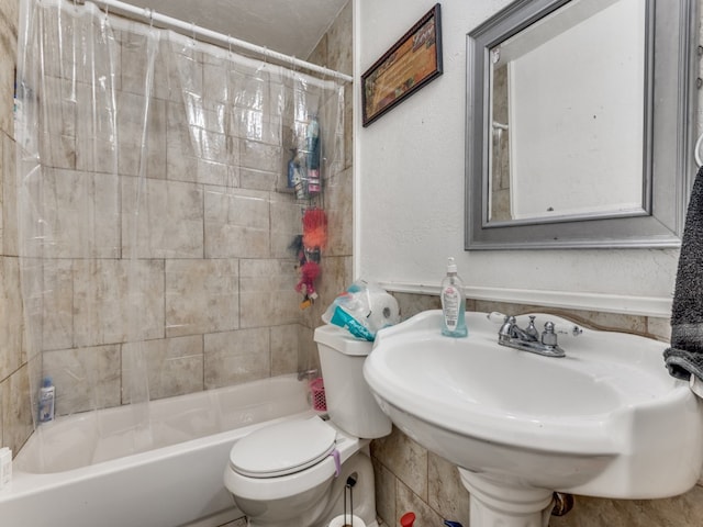 bathroom with toilet and shower / tub combo with curtain