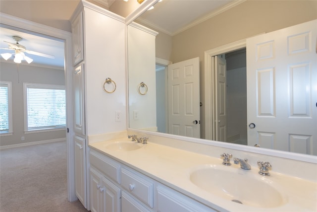 bathroom with ornamental molding, vanity, and ceiling fan