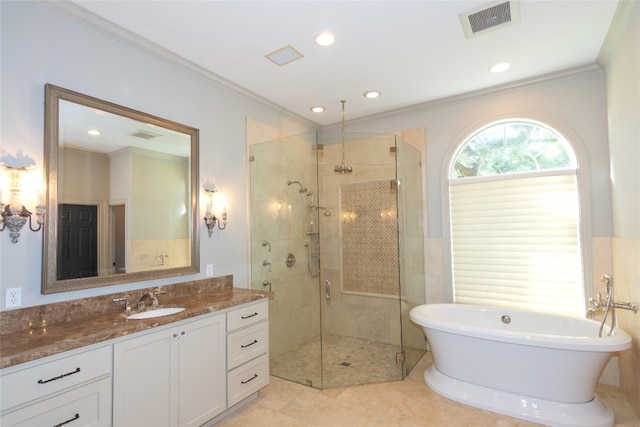 bathroom featuring vanity, plus walk in shower, crown molding, and tile patterned flooring