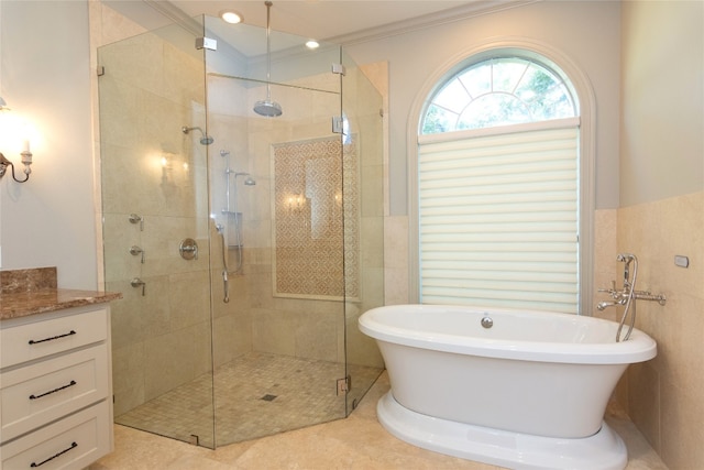 bathroom with independent shower and bath, vanity, ornamental molding, and tile patterned floors