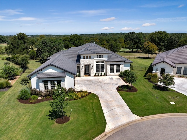 view of front of home with a front yard and french doors