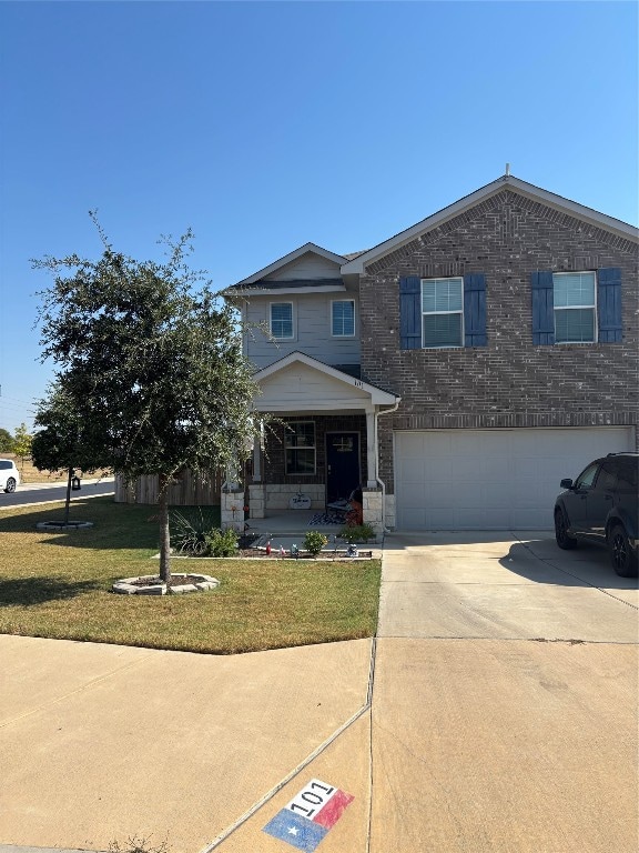 view of front facade featuring a garage and a front yard