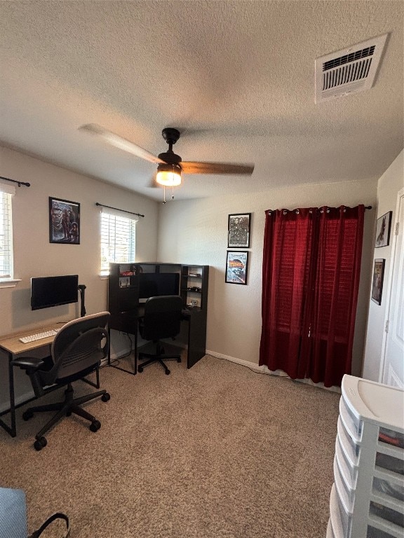 office with light colored carpet, a textured ceiling, and ceiling fan