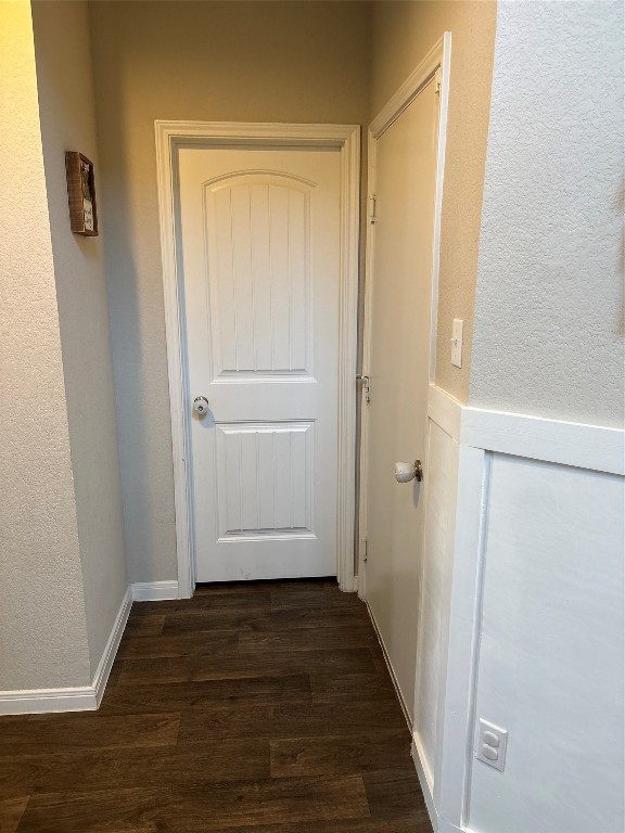 doorway with dark hardwood / wood-style floors